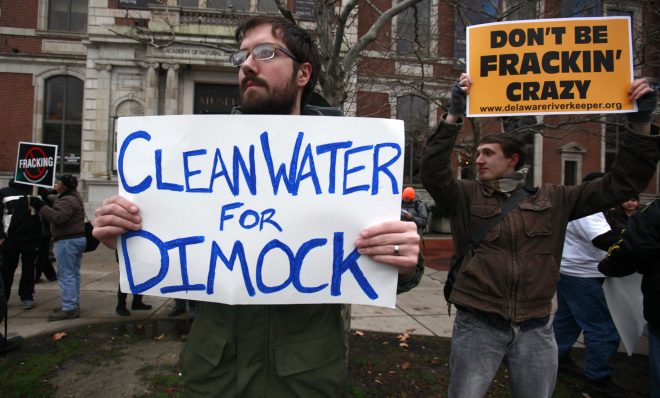 Protestors called for clean water for Dimock in a Philadelphia demonstration in 2012. Two families that sued Cabot Oil & Gas have settled.