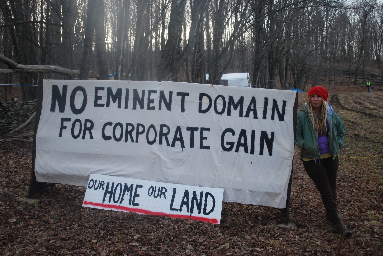 Megan Holleran stands by a sign on her family's land, March, 2016. The Hollerans lost their court battle to save their maple trees from eminent domain seizure. The trees were cut to make way for the Constitution Pipeline, which had been stalled amid legal battles until Williams withdrew the project in February.