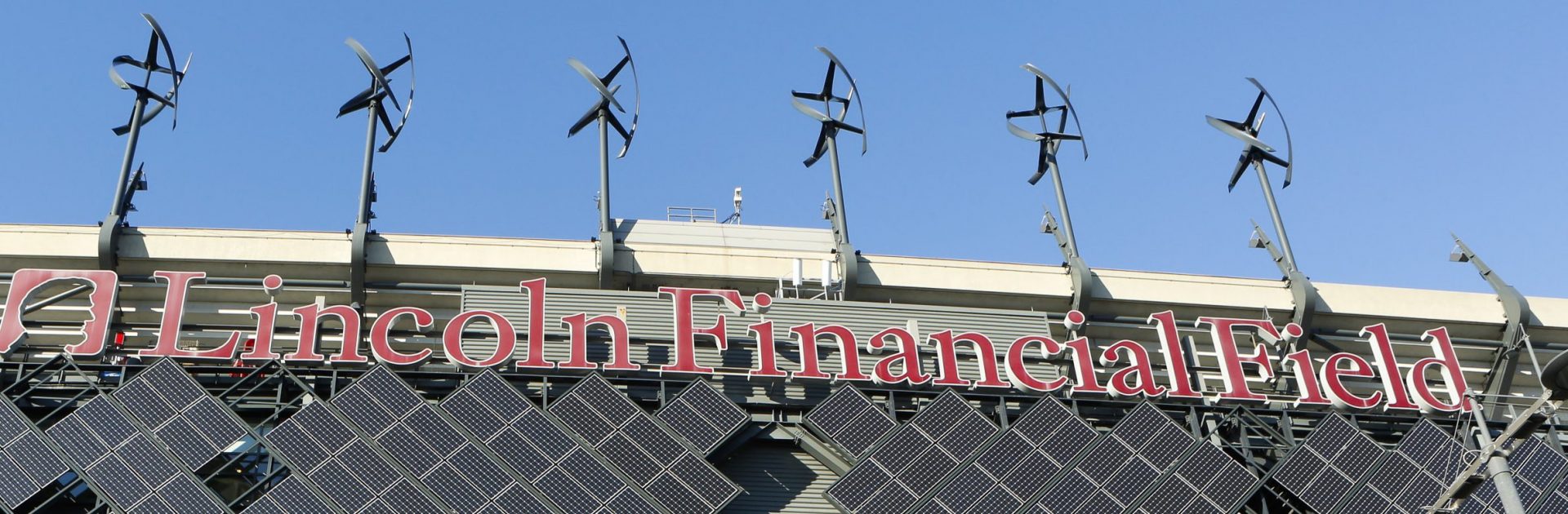 Micro-wind turbines and solar panels installed at Lincoln Financial Field in Philadelphia generate renewable energy. The state's Climate Action Plan recommends rooftop solar and more energy efficient buildings.