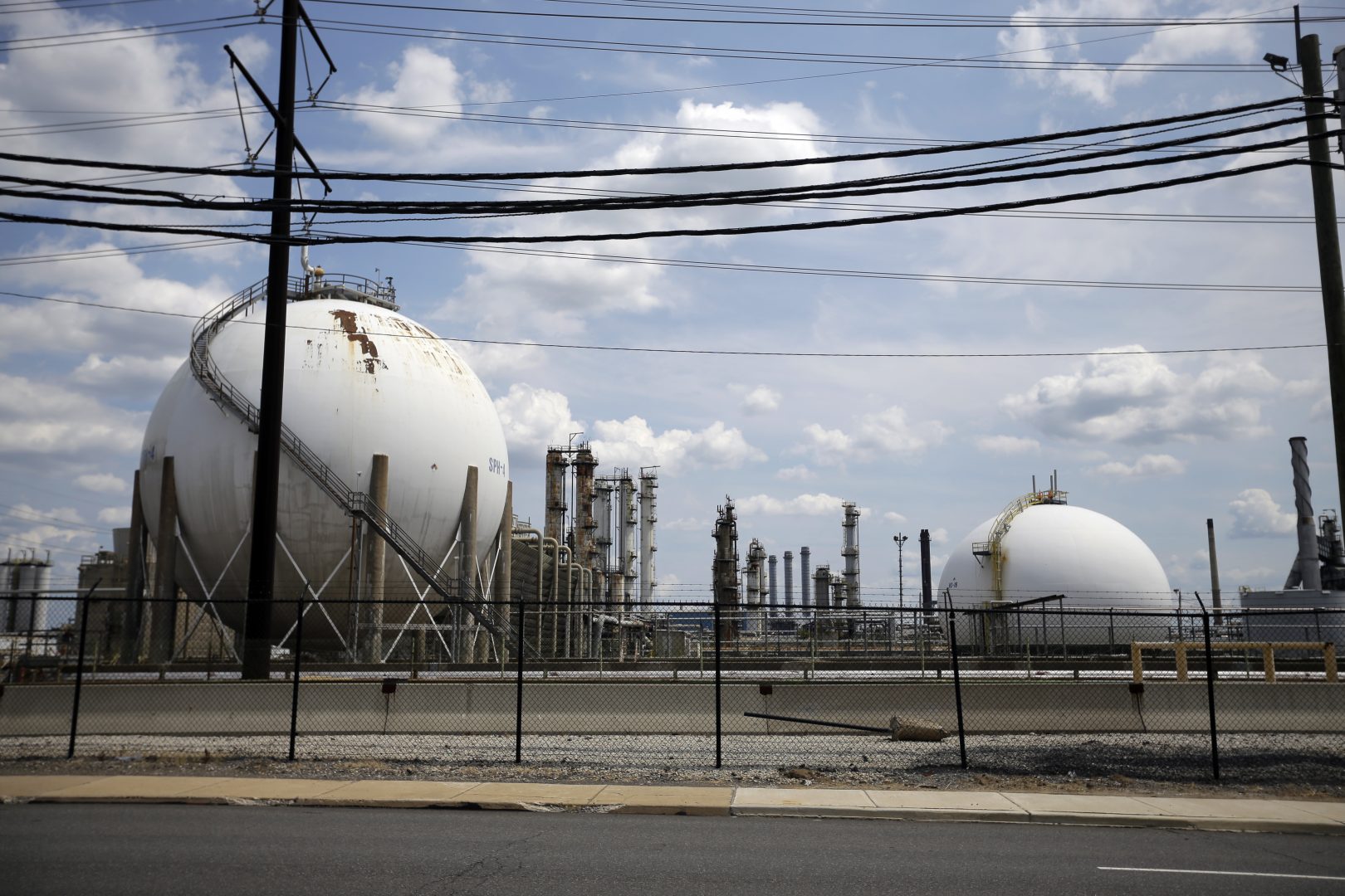This photo taken on July 11, 2012, shows the Marcus Hook Refinery in Marcus Hook, Pa. The facility, which is owned and operated by Sunoco Logistics, is an international hub for natural gas liquidspropane, ethane, and butanefrom the Marcellus Shale region of Western Pennsylvania. Sunoco Logistics is spending roughly $2.5 billion on the Mariner East projects, which will connect the western part of the state to the port at Marcus Hook.  