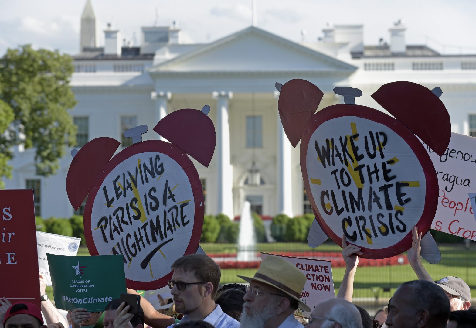 Protesters gather outside the White House in Washington, Thursday, June 1, 2017, to protest President Donald Trump's decision to withdraw the Unites States from the Paris climate change accord.