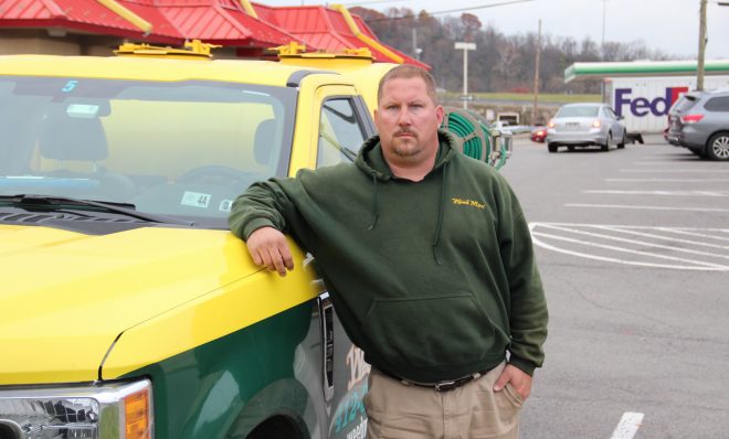 Elton Reha says he's happy he left coal mining to work at a lawn care company. Photo: Reid R. Frazier