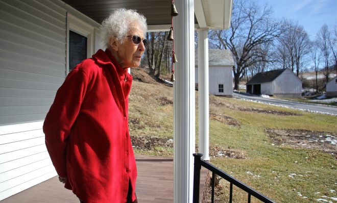 From the porch of her Palmerton farmhouse, Albertine Anthony looks out on the rolling hills of lower Carbon County. She believes the PennEast pipeline's proposed route through her 124-acre farm threatens her water supply. (Emma Lee/WHYY)