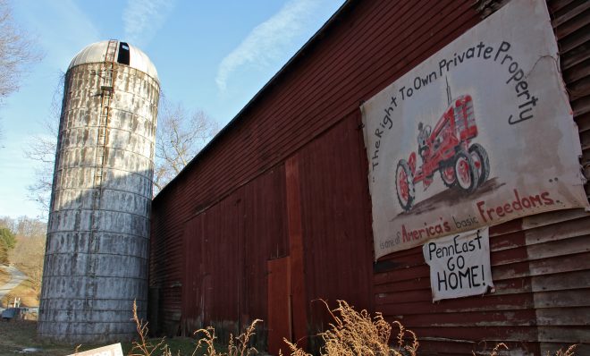 In this 2018 photo, a sign on Riegelsville Road in Holland Township, New Jersey, shows local opposition to the PennEast pipeline.  