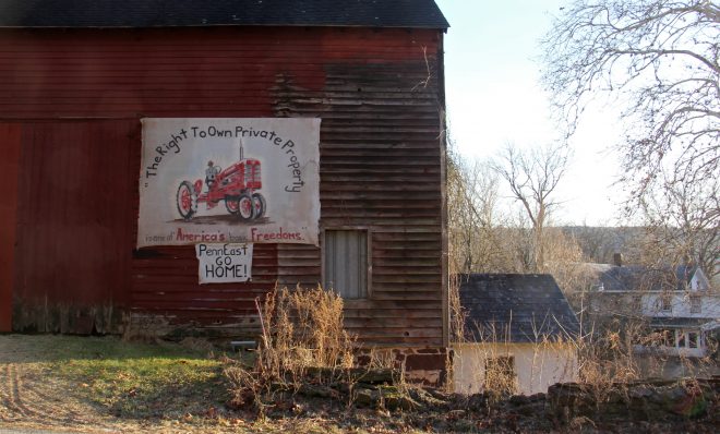 A sign on the side of a barn on Riegelsville Road in Holland Township, New Jersey, shows local opposition to the PennEast pipeline. 