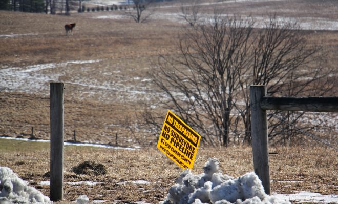 A sign on farmland in Palmerton shows local opposition to the PennEast pipleline. Some believe land under the Farmland Preservation program has been targeted for the route because of it's lower market value. (Emma Lee/WHYY)