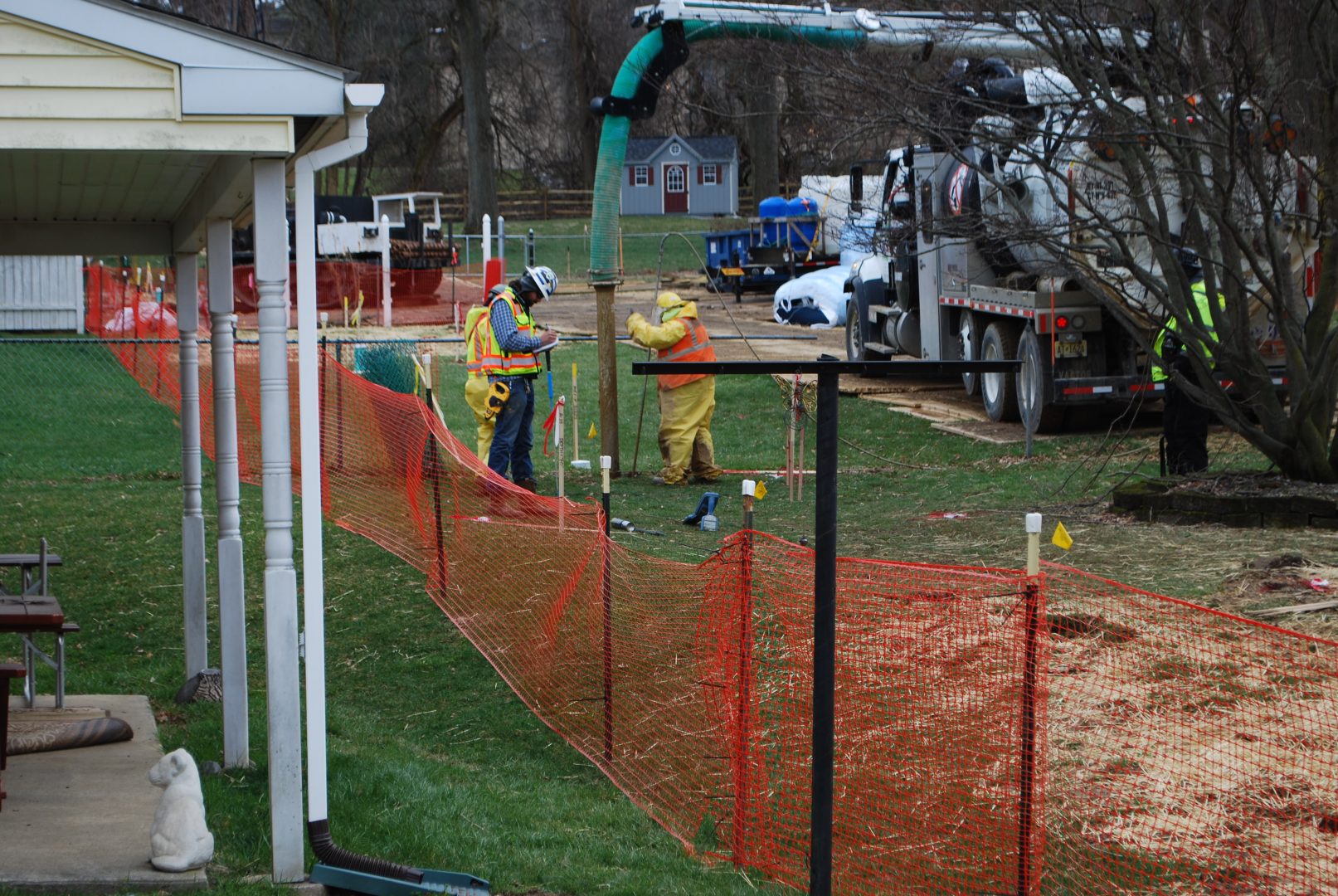 In this photo from May 2018, pipeline workers probe the ground on Lisa Drive in West Whiteland Township where sinkholes have developed as a result of the Mariner East 2 construction. 