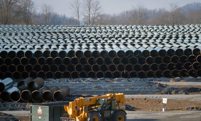 Along U.S. Route 19 in southern West Virginia, row after row of pipe is stockpiled in preparation for construction of the 300-mile Mountain Valley Pipeline, one of several major natural gas pipelines that will crisscross the state as the industry booms. 