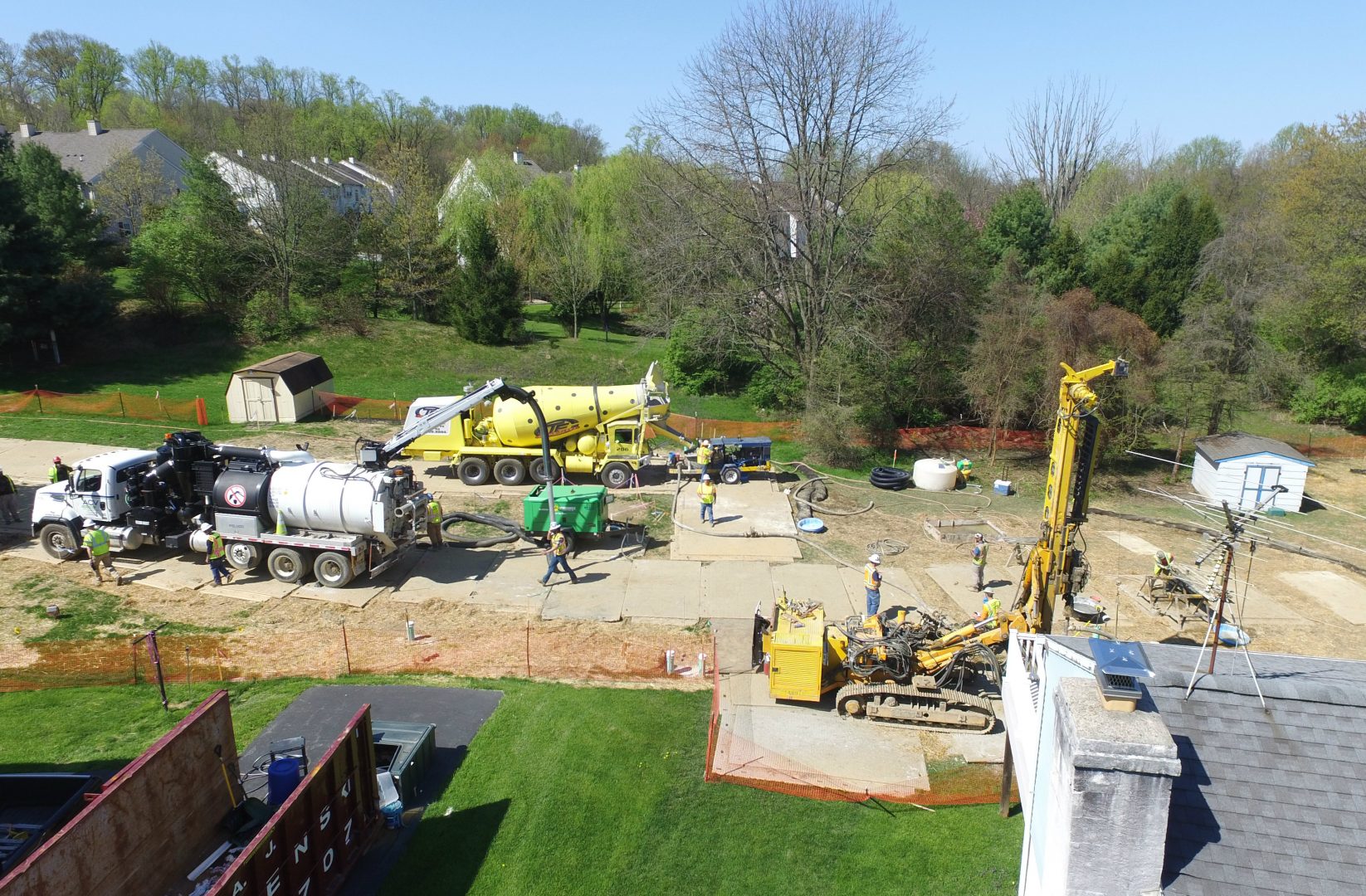 In this file photo, Mariner East 2 pipeline construction crews work in the backyards of homes on Lisa Drive in West Whiteland Township, Chester County, on May 2, 2018 after sinkholes opened in the area. That caused one of the ME2 project's many delays.