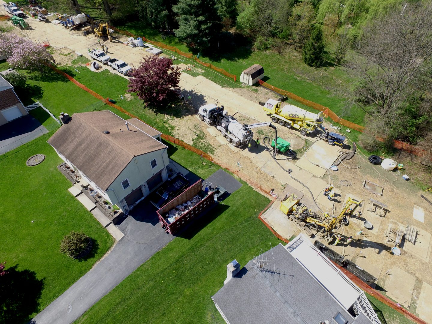 In this photo from May 2018, Mariner East 2 pipeline construction crews work in the backyards of homes on Lisa Drive in West Whiteland Township, Chester County. The area has dealt with a number of sinkholes, including one on July 6, 2023. The problem led to Energy Transfer buying at least five homes along Lisa Drive after the aquifer there was damaged.