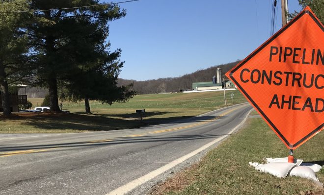 A sign warns drivers of natural gas pipeline construction ahead.