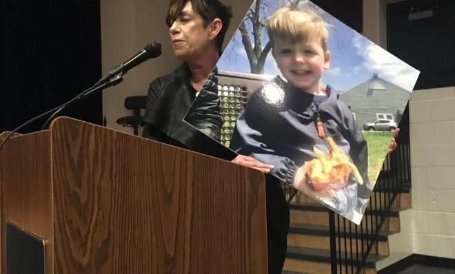 Denise McCarthy told a Department of Environmental Protection hearing that the Mariner East pipelines would endanger her grand nephew, Jack, whose picture she held up as she spoke. DEP held the public meeting in May to hear comment on Sunoco's proposed permit modifications in West Whiteland Township, Chester County.