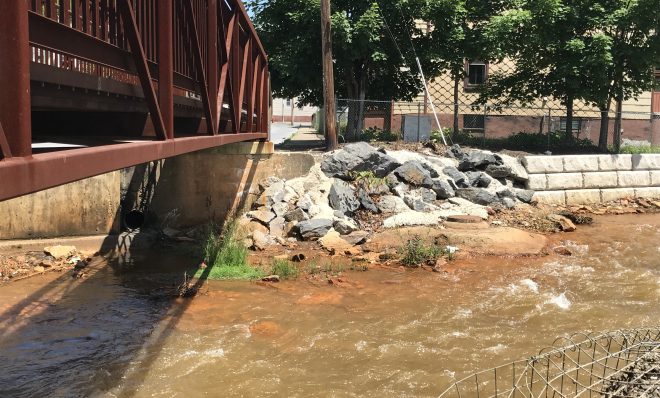 This file photo shows Shamokin Creek in Shamokin, Pa. Drainage from thousands of abandoned coal mines has contaminated thousands of miles of rivers and streams in the state.