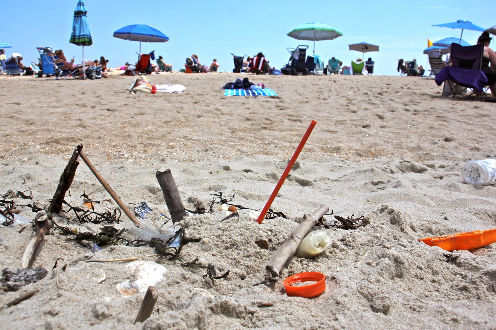 Plastic trash is deposited at the high tide line at Monmouth Beach, New Jersey. A new local law prohibiting merchants from using plastic straws, styrofoam food containers, and plastic bags is a small step in the right direction, supporters say.  