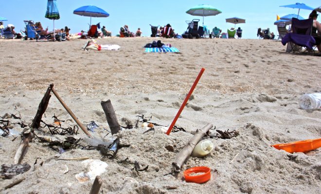 Plastic trash is deposited at the high tide line at Monmouth Beach, New Jersey. A new local law prohibiting merchants from using plastic straws, styrofoam food containers, and plastic bags is a small step in the right direction, supporters say.  