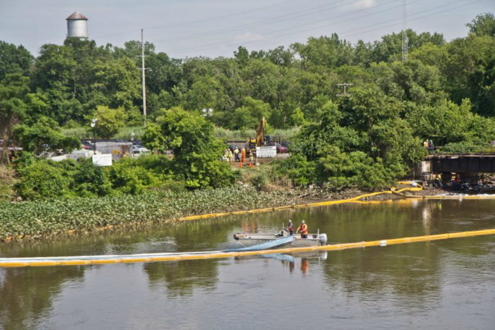 An environmental cleanup crew works to remove fuel from a spill in Darby Creek in Tinicum Township, Pennsylvania, near the Philadelphia International Airport. Sunoco plans to use this same line to ship natural gas liquids until construction along the Mariner East 2 is completed.