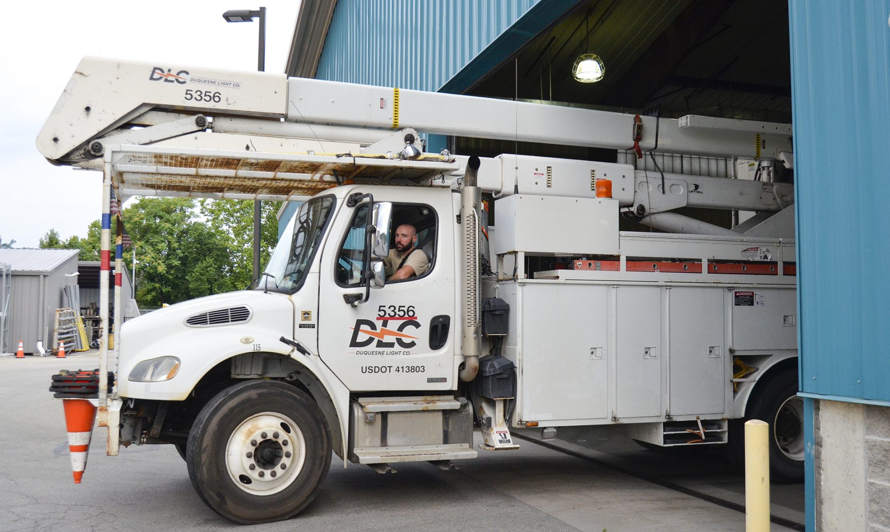 A Duquesne Light bucket truck leaves the utility's Preble Service Center.