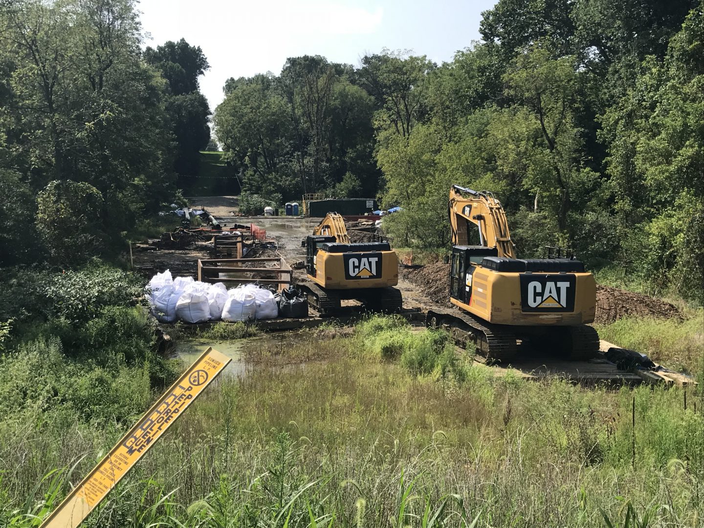 In this 2018 file photo, Energy Transfer, the parent company of Mariner East 2 pipeline builder, Sunoco, works at Snitz Creek in West Cornwall Township, Lebanon County after a drilling mud spill during the summer. (Marie Cusick/StateImpact Pennsylvania)