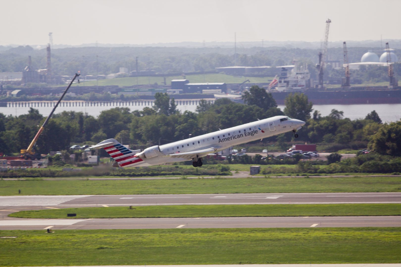 A plane takes off from Philadelphia International Airport, located near the Delaware River.