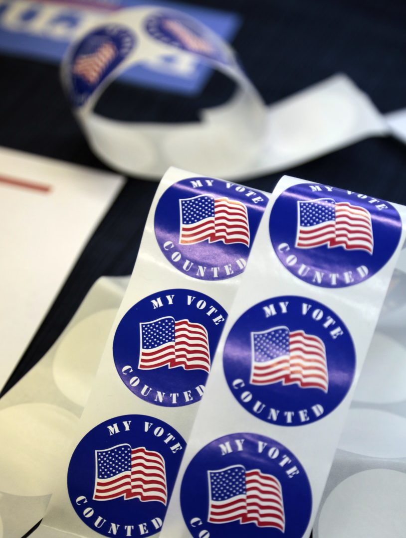 Stickers for voters are seen on a table at a polling station Tuesday, April 26, 2016 in Wayne, Pa. 