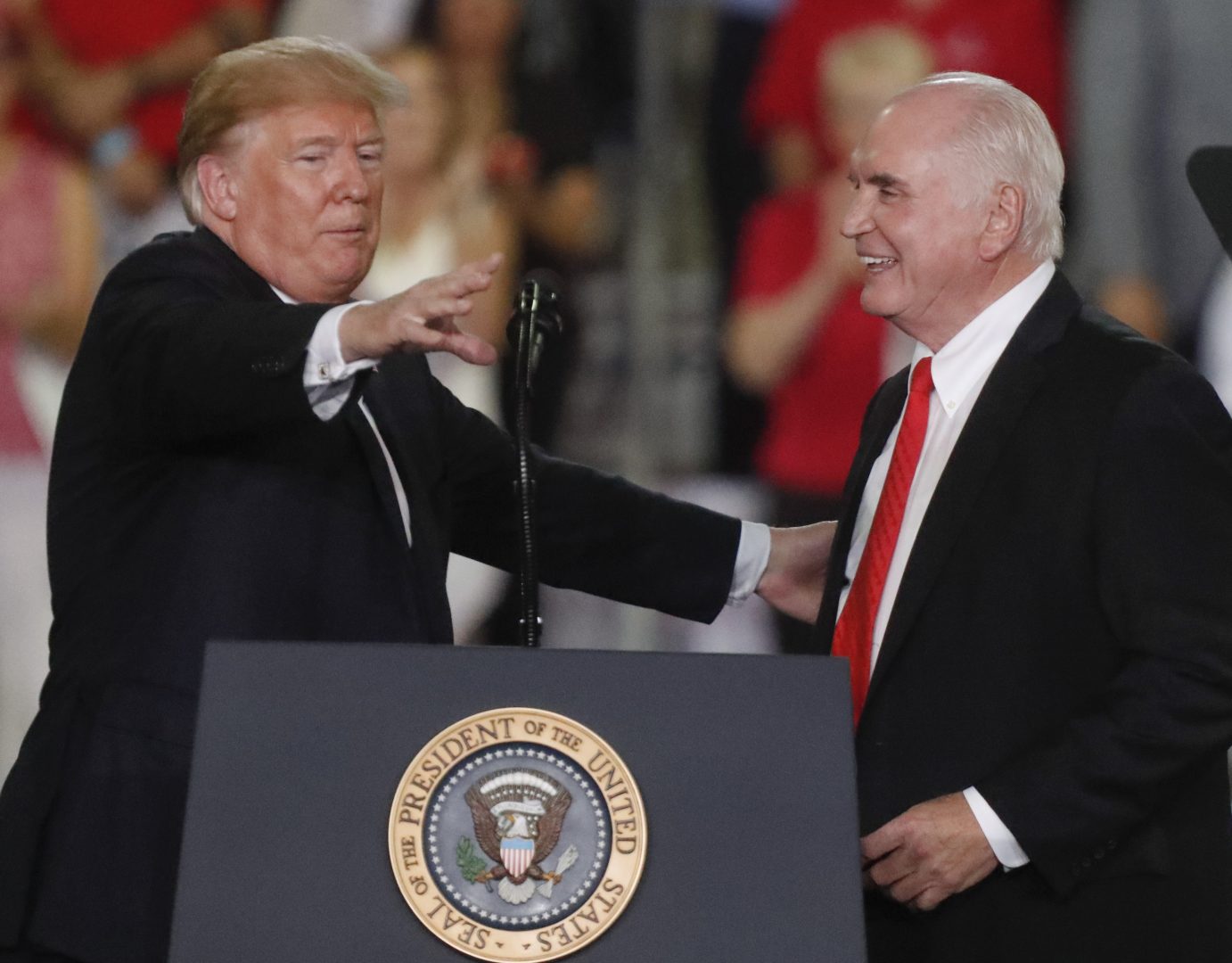 President Donald Trump, left introduces U.S. Congressman Mike Kelly at a rally endorsing the Republican ticket in Pennsylvania on Wednesday, Oct. 10, 2018 in Erie, Pa. 
