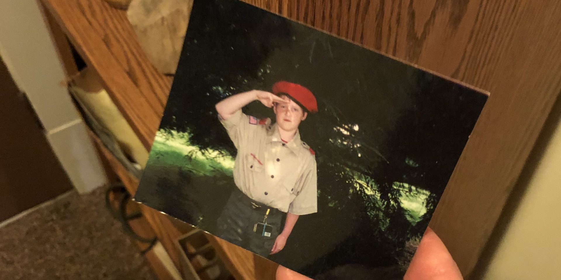 Dylan Elchin is seen as a child in this photograph, wearing a Boy Scout uniform and red beret. Years later, he would earn the honor of wearing a scarlet beret as a combat controller in the Air Force.