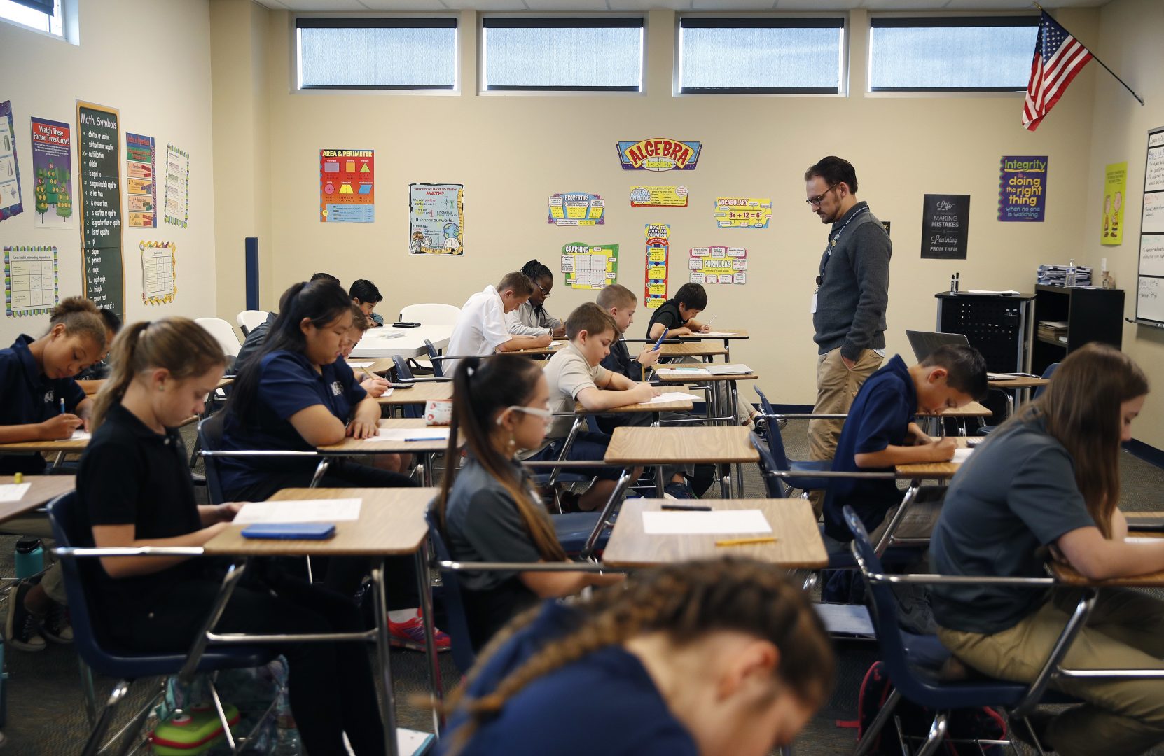 In this Nov. 16, 2017, photo, students take a quiz in Michael Briggs' seventh grade algebra class at Lake Mead Christian Academy in Henderson, Nev.