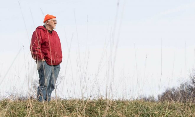 David Wentz looks out from a hill on his land. Wentz sued EQT Corp. for building natural gas wells there. 

