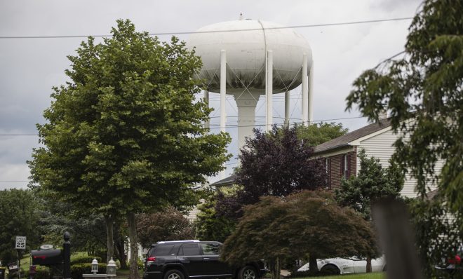 In this Aug. 1, 2018 photo, a water tower stands above a residential neighborhood in Horsham, Pa. In Horsham and surrounding towns in eastern Pennsylvania, and at other sites around the United States, the foams once used routinely in firefighting training at military bases contained per-and polyfluoroalkyl substances, or PFAS. EPA testing between 2013 and 2015 found significant amounts of PFAS in public water supplies in 33 U.S. states. 