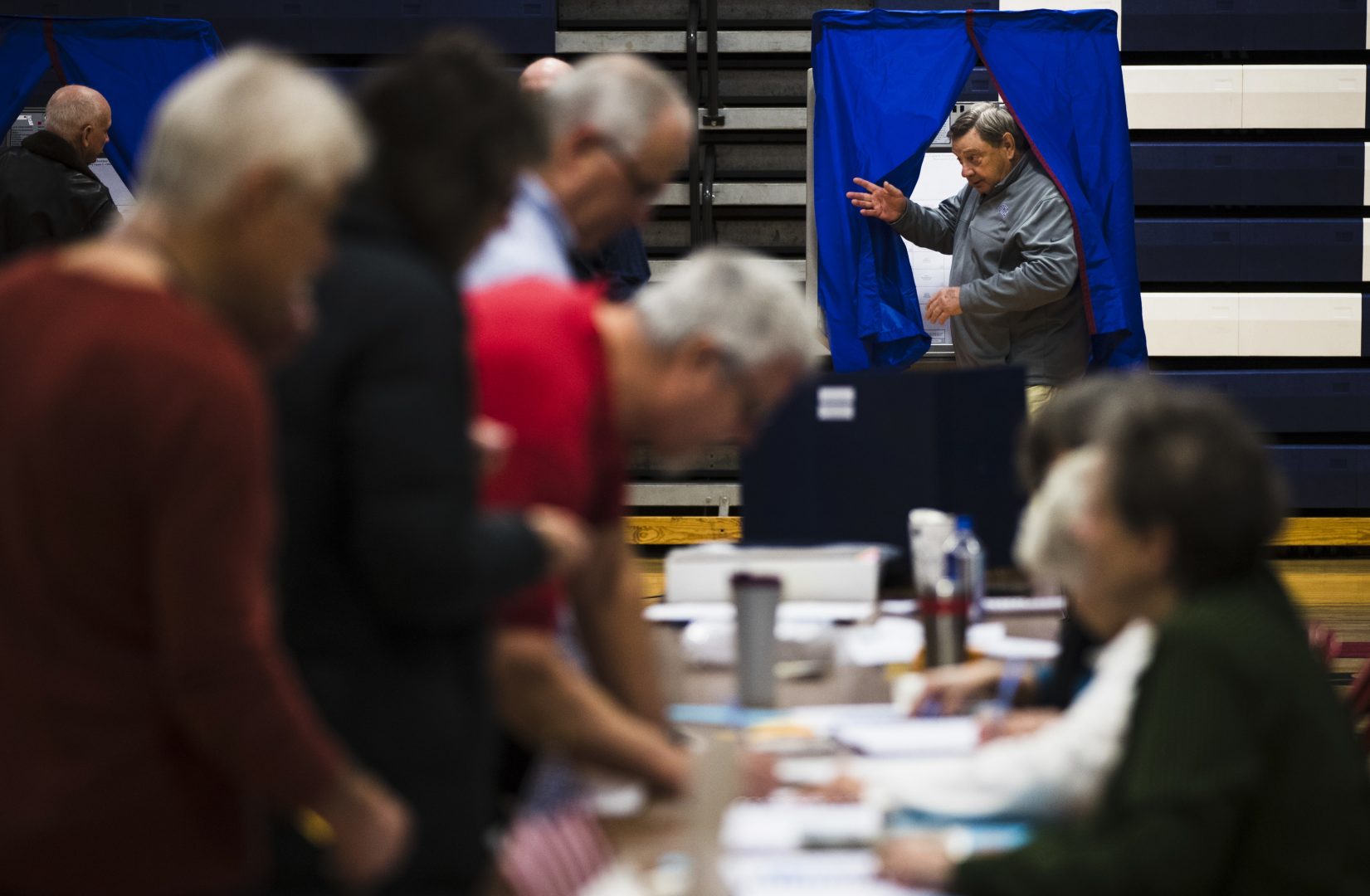 A voter steps from the voting booth after casting his ballot in Doylestown, Pa., Tuesday, Nov. 6, 2018. 