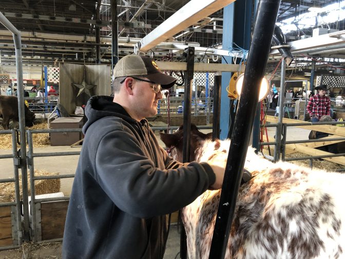 Cumberland County dairy farmer Jason Nailor is seen working at the Pennsylvania Farm Show Complex on Jan. 8, 2019.