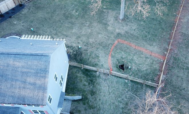A sinkhole that opened up in January was surrounded by orange plastic fencing outside a suburban home at Lisa Drive in West Whiteland Township, Chester County. 