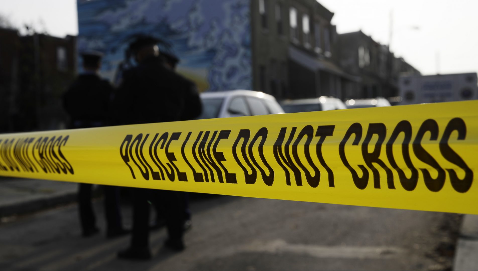 FILE PHOTO: In this Nov. 19, 2018, file photo, police gather at the scene of a quadruple fatal shooting in Philadelphia. Philadelphia's homicide rate is the highest in over a decade, as a particularly violent summer morphed into a deadly fall and the mayor declared gun violence a public health emergency.