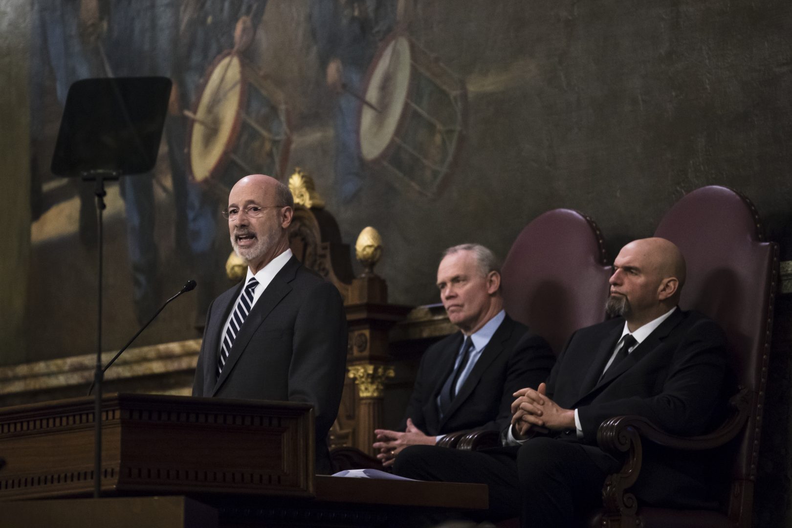 Democratic Gov. Tom Wolf, left, delivers his budget address for the 2019-20 fiscal year to a joint session of the Pennsylvania House and Senate in Harrisburg, Pa., Tuesday, Feb. 5, 2019. House Speaker Mike Turzai, R-Allegheny, is at the center, and Lt. Gov. John Fetterman is at the right.