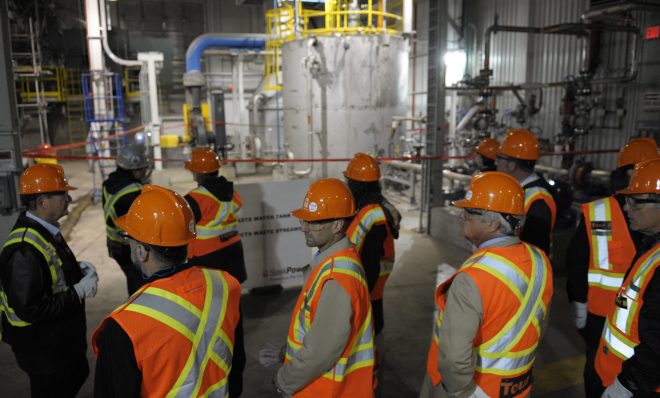 Visitors tour a carbon capture and storage facility during its official opening at the Boundary Dam Power Station in Estevan, Saskatchewan in 2014. SaskPower said the $1.4-billion facility is to take carbon dioxide released by the Boundary Dam power plant near Estevan and release the gas deep underground using a steel pipeline for storage. 