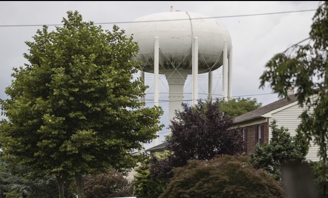 In this Aug. 1, 2018 photo, a water tower stands above a residential neighborhood in Horsham, Pa. In Horsham and surrounding towns in eastern Pennsylvania, and at other sites around the United States, the foams once used routinely in firefighting training at military bases contained per-and polyfluoroalkyl substances, or PFAS. EPA testing between 2013 and 2015 found significant amounts of PFAS in public water supplies in 33 U.S. states. 