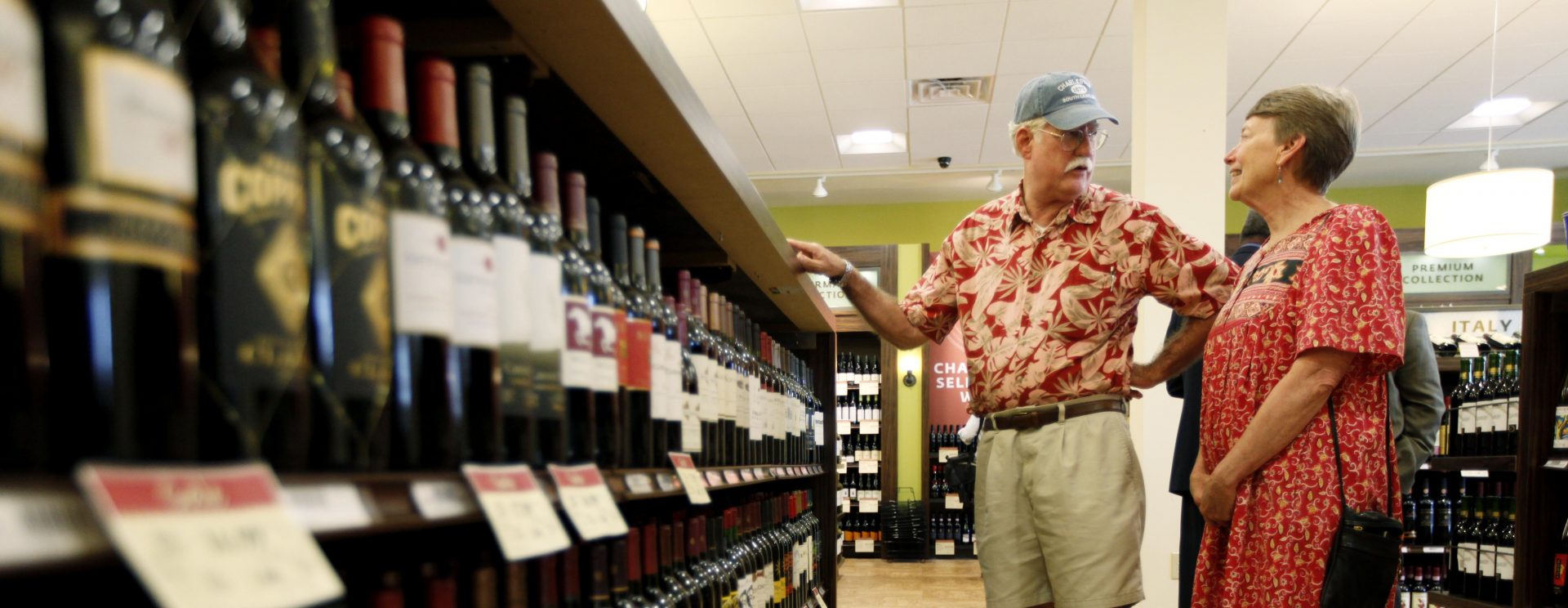 In this Thursday, July 22, 2010 photo, Hugh and Karen Hoffman of Wycombe, Pa. shop at a state wine and liquor store in New Hope, Pa.