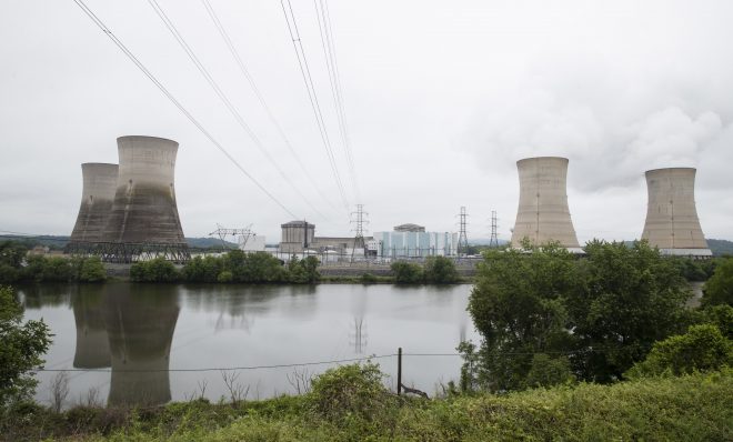 FILE - In this May 22, 2017 file photo shown is the Three Mile Island nuclear power plant in Middletown, Pa. With nuclear power plant owners seeking a rescue in Pennsylvania, a number of state lawmakers are signaling that they are willing to help, with conditions.  Giving nuclear power plants what opponents call a bailout could mean a politically risky vote to hike electric bills. (AP Photo/Matt Rourke, File)