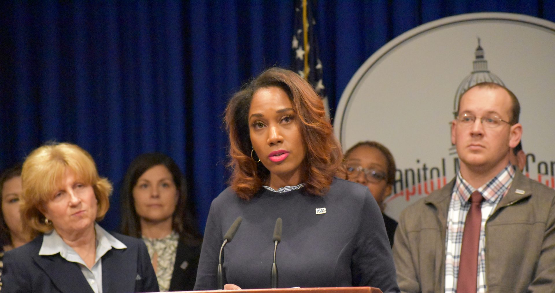 Bridgette May, a certified school nurse in the Erie City School District, speaks during a news conference at the state Capitol on March 26, 2019.