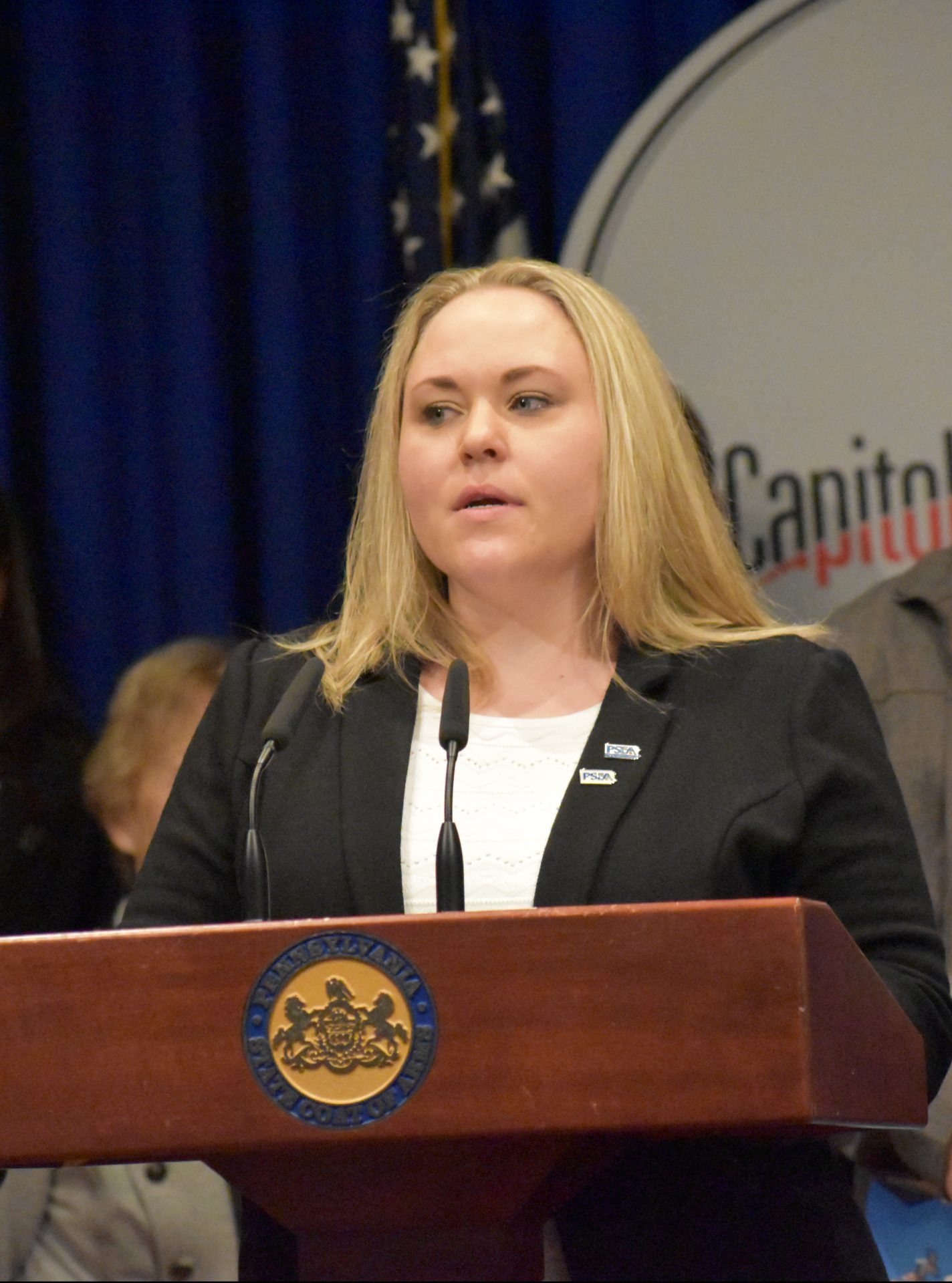 Stacie Baur, a teacher in the Clairton City School District, speaks during a news conference on March 26, 2019.