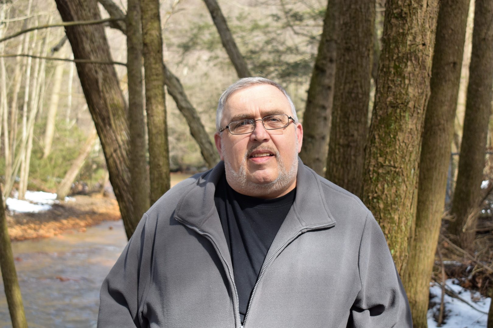 Bob Smith stands in the backyard of his home in Schuylkill County on March 11, 2019. He asked PA Post whether something can be done about Pennsylvania's property taxes.