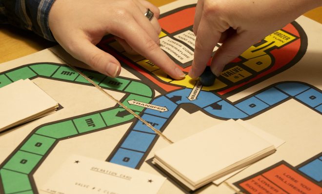 Lisa Wardle and Marie Cusick play the REACT-OR board game at Dickinson College.