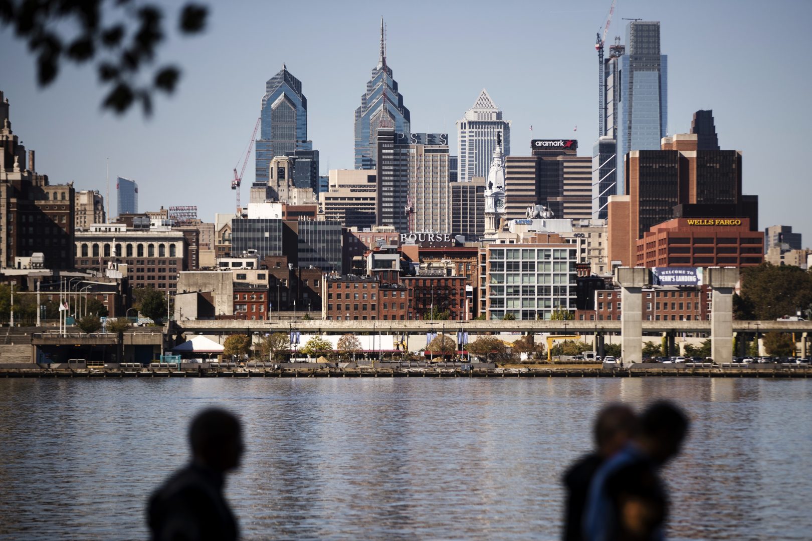 The Philadelphia skyline is seen along the banks of the Delaware River. 