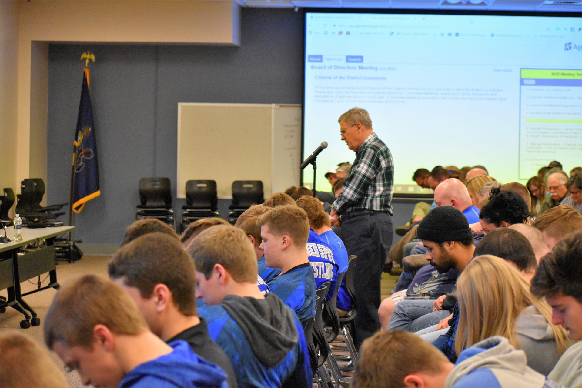 A community member leads a prayer during the public comment section of the Eastern Lancaster County school board meeting on April 15, 2019.