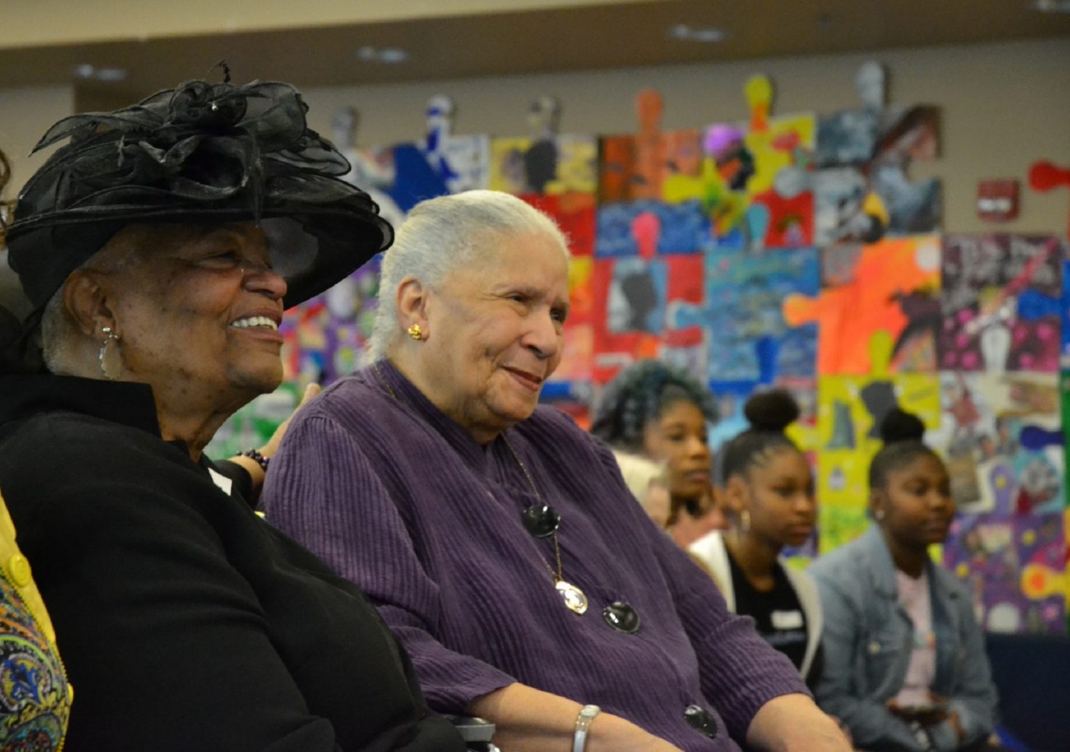 Bertha Garnett, center, listens to speakers at an event honoring her son, Reuben Garnett Jr., who was killed in action in Vietnam. At left is her daughter, India Garnett, who worked for decades to have her brother's service honored. Bertha's great-granddaughters Courtney, Tianna and Sheniah can be seen in the background.