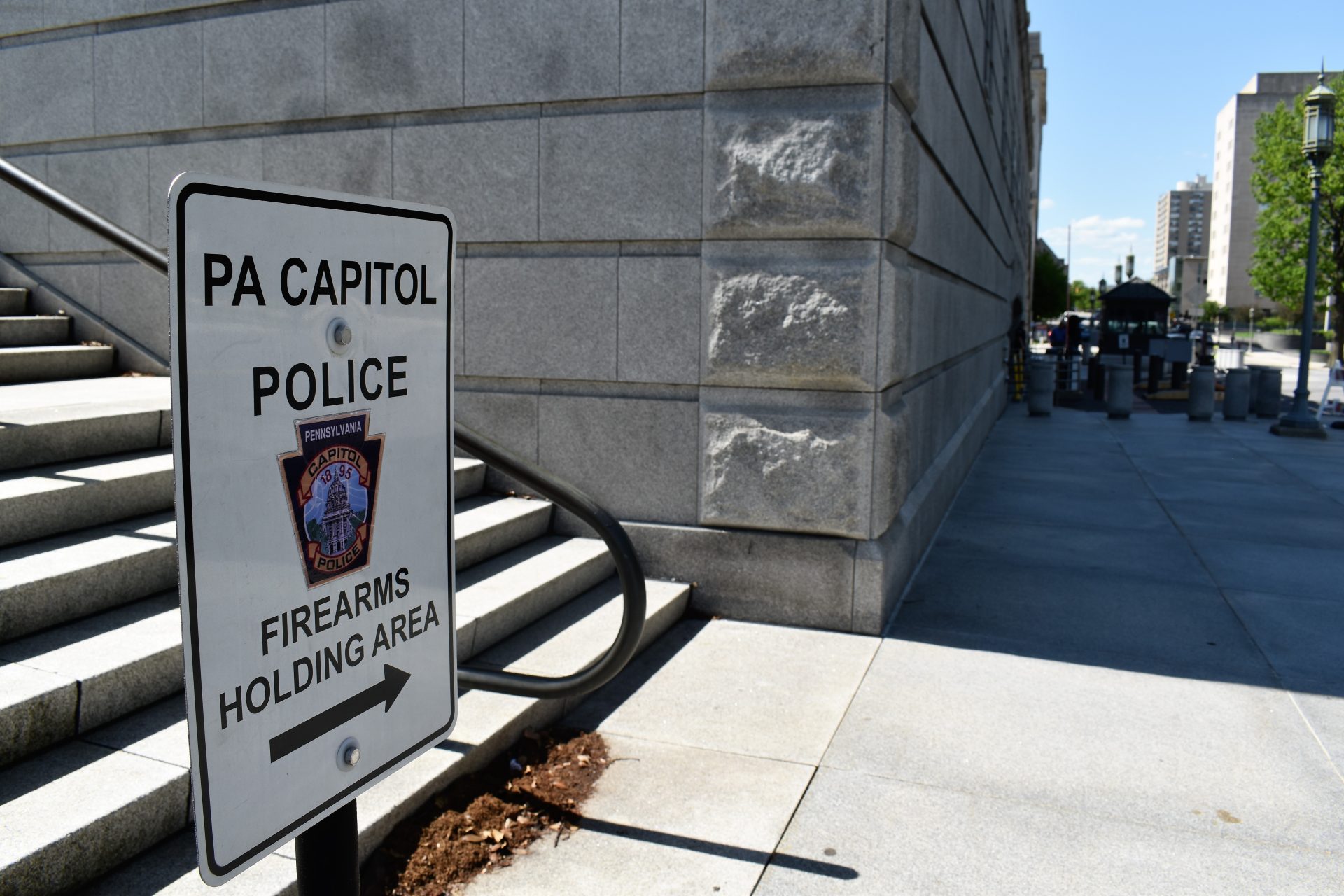 A sign outside the state Capitol directs people to a firearms holding area on May 6, 2019.