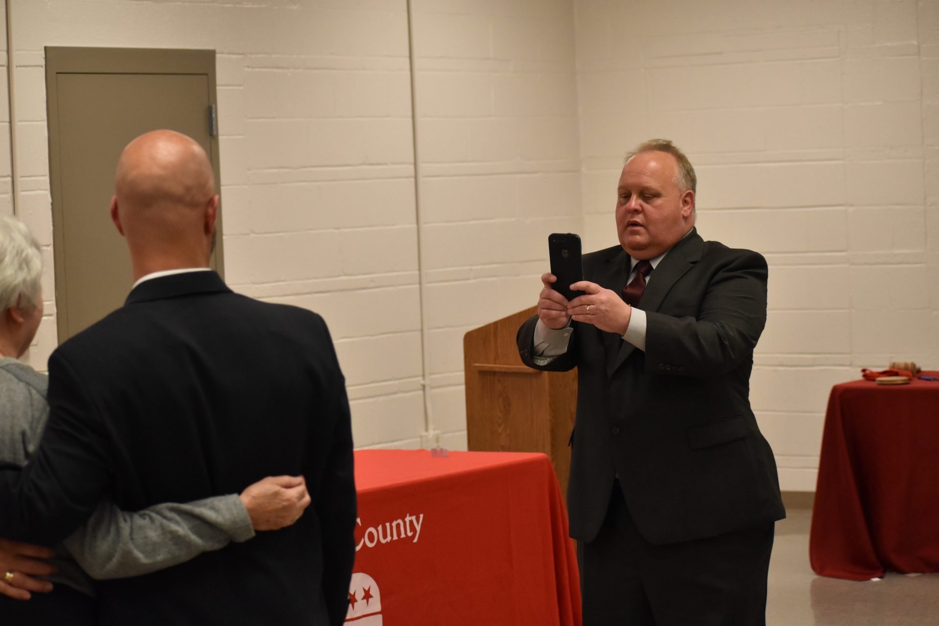 Republican commissioner candidate Ron Smith takes a picture for people who attended a debate on April 29, 2019, at Shiloh Fire Company in York County.
