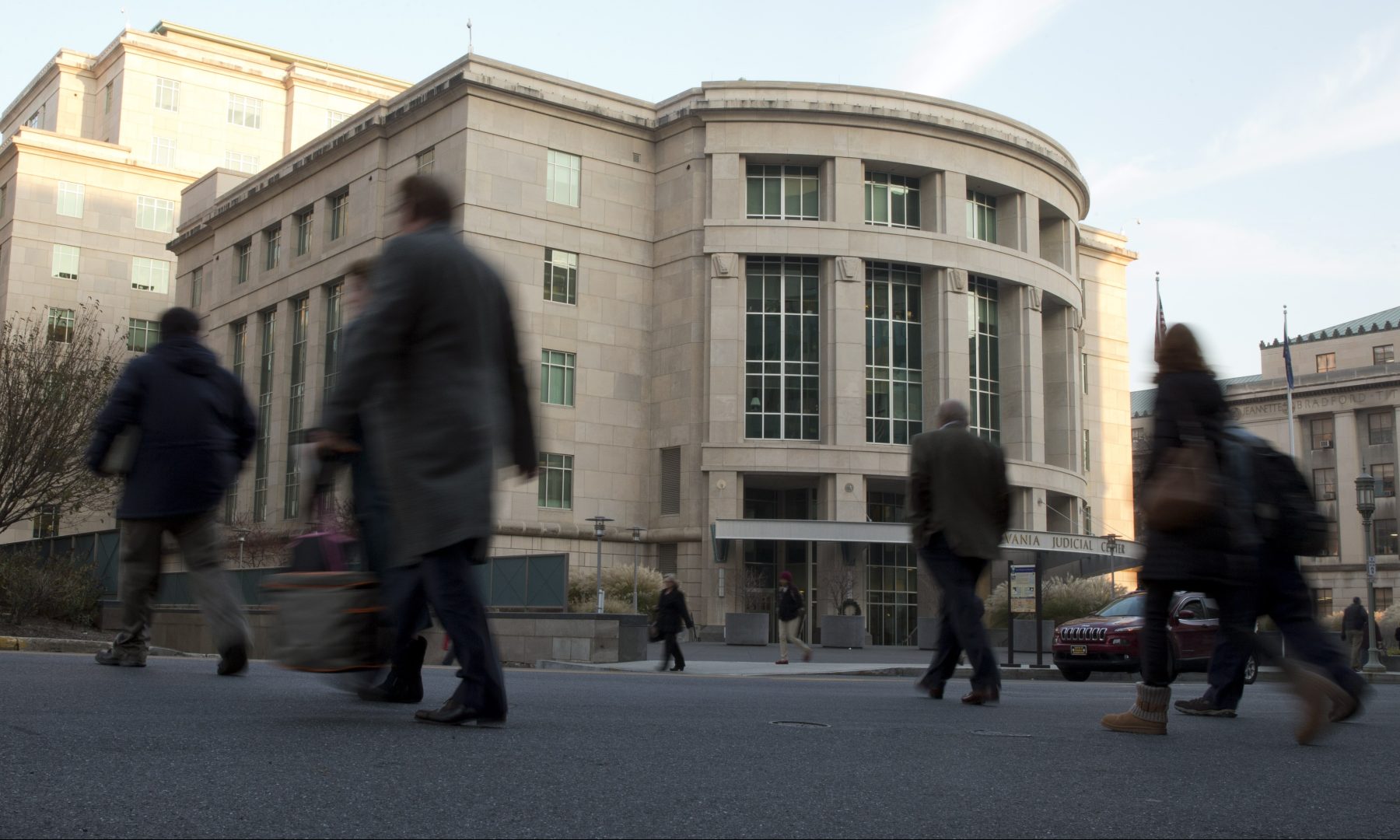FILE PHOTO: People walk by the Pennsylvania Judicial Center Tuesday, Dec. 8, 2015, at the state Capitol in Harrisburg.  
