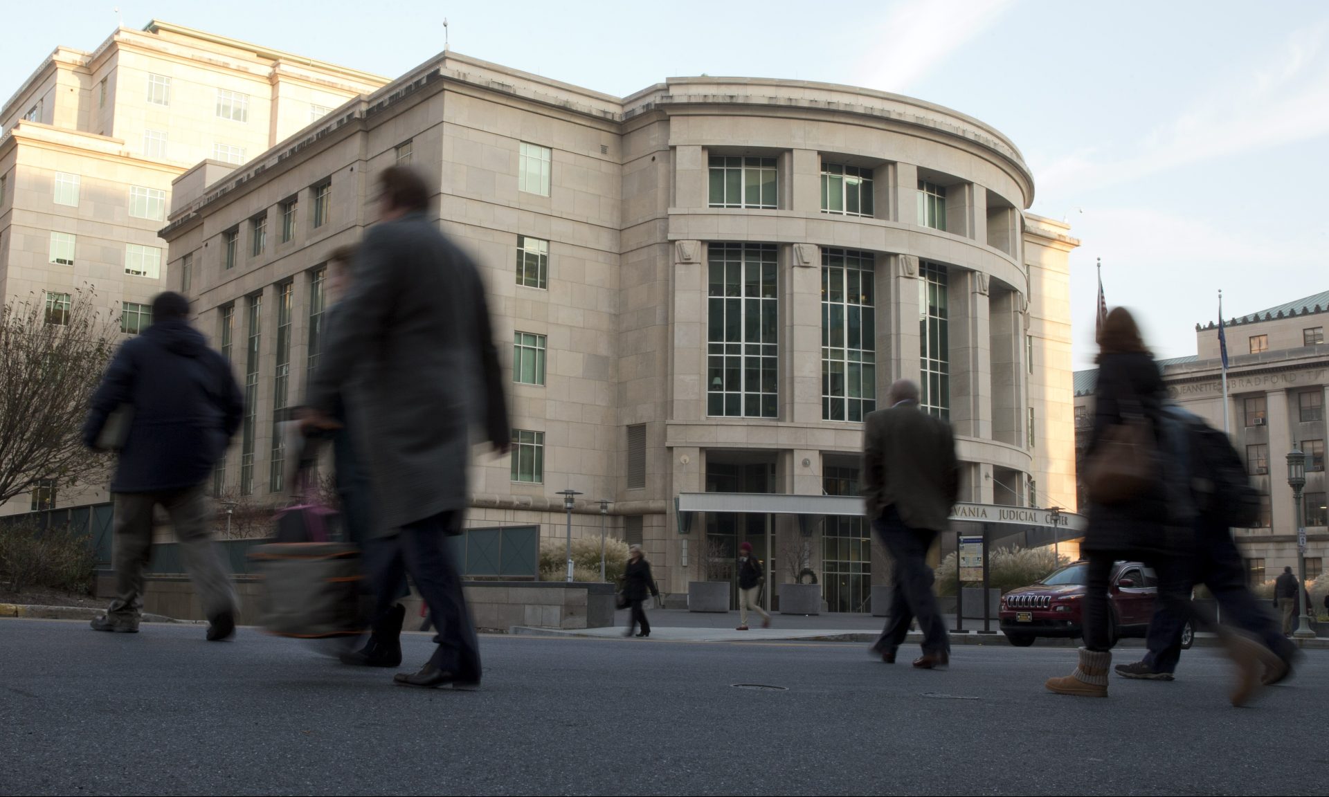 People walk by the Pennsylvania Judicial Center Tuesday, Dec. 8, 2015, at the state Capitol in Harrisburg.