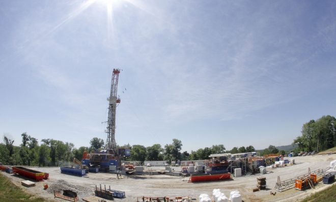 In this July 27, 2011 photo, the sun shines over a Range Resources well site in Washington, Pa. In 2018, Range paid the highest impact fee of any driller in Pennsylvania.
